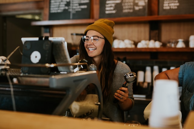 happy female in a coffee shop