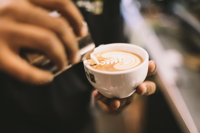 a barista making coffee