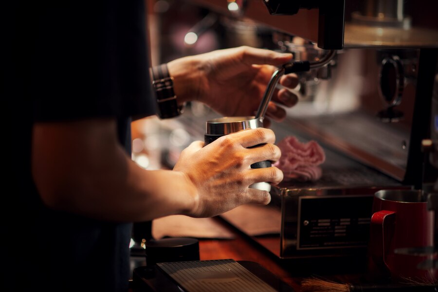 A person taking a barista training course in Melbourne.