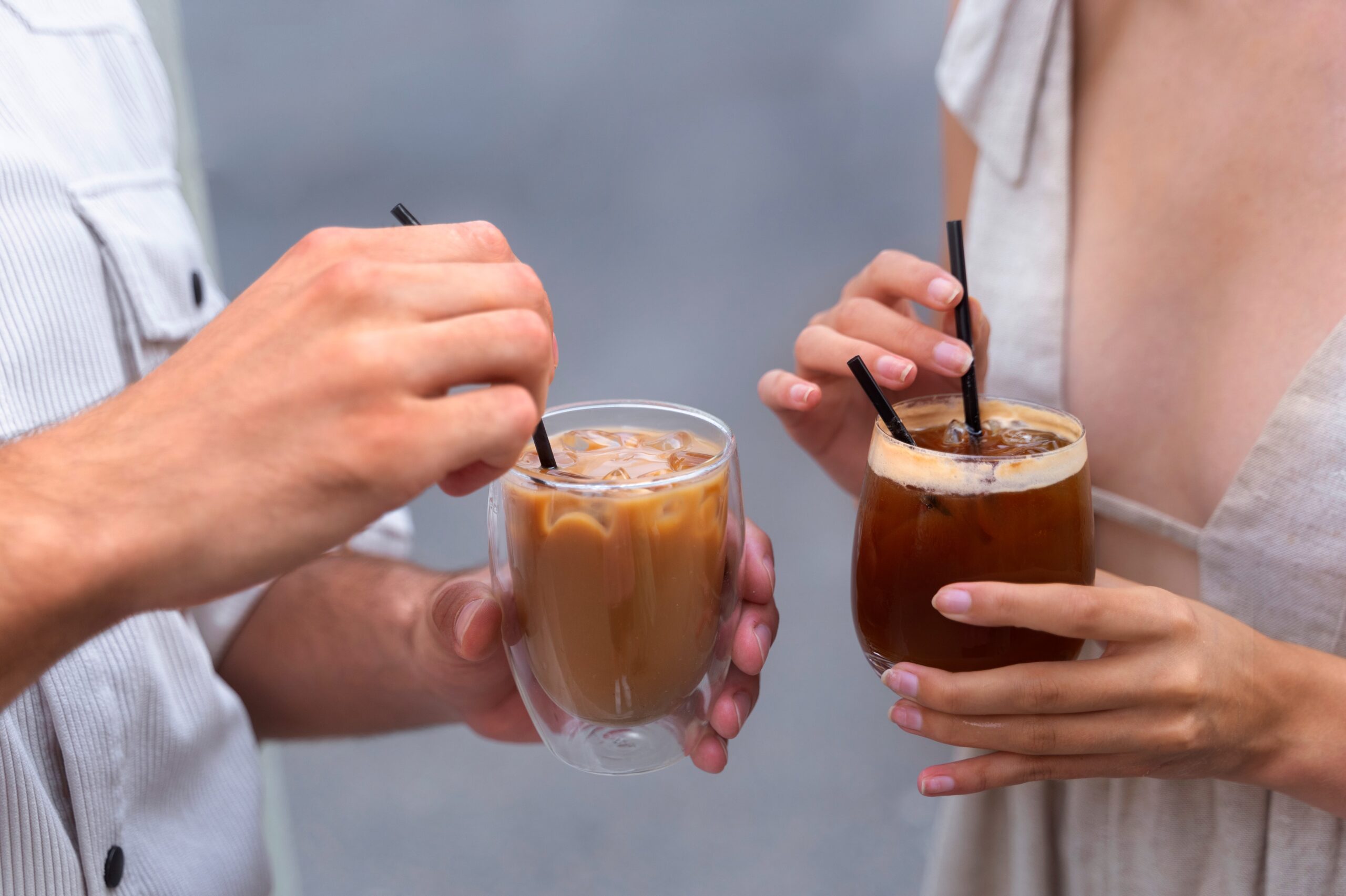 people holding iced coffee and cold brew